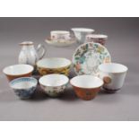 A selection of Chinese export tea bowls, two similar saucers, a sparrow beak jug and a blanc de