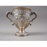 A Georgian silver two-handled pedestal cup with later embossed decoration, 13.8oz troy approx