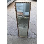 A gilt framed slip mirror, plate 11" x 48"