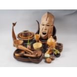 A quantity of treen, including a pair of African style masks, various bowls, etc