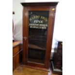 An early 20th century mahogany display cabinet enclosed glazed panel door, inscribed "Hardy Bros