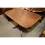 A mahogany and boxwood strung tilt-top single pedestal breakfast table, on quadruple splay supports