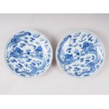 A pair of Chinese porcelain blue and white dishes, decorated dragons, clouds, and flaming pearls,