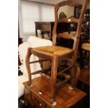 A set of six French polished as walnut rush seat ladder back dining chairs, on cabriole supports