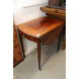 A late 19th century mahogany oval Pembroke table, fitted one drawer, on square taper supports, 28"