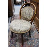 A child's bentwood chair with seat and back upholstered in a jacquard fabric