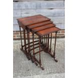 A nest of four mahogany quartetto tables of Regency design, 21" wide x 40 1/2" deep x 29 1/2"