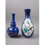 A Chinese baluster vase, decorated panels with a bird in a tree and a figure in a landscape on a