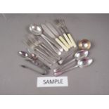 A quantity of loose silver plate cutlery, a silver ladle and a teaspoon