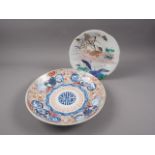 An Imari dish with traditional decoration, 12" dia, and a shallow relief decorated shaped edge plate