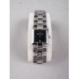 A lady's Emporio Armani wristwatch with square face, in original case with documentation
