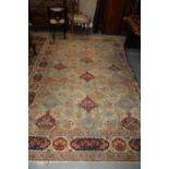 A Persian city rug with all-over floral design on a light blue ground, 122" x 87" approx (worn)