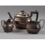 A silver melon teapot with ebonised knop and handle, and a matching milk jug and sugar bowl, 35.