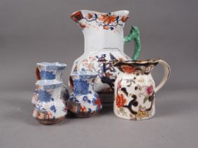 A Mason's Ironstone jug with branch handle and Imari landscape decoration, 9 1/2" high, a set of