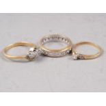 A 9ct gold and diamond dress ring, size J, 1.1g, an 18ct gold and diamond crossover ring, size N,