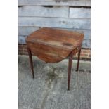 A 19th century mahogany oval Pembroke table, fitted one drawer with brass ring handle, on square