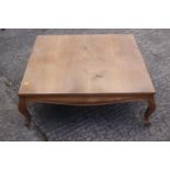 A faded mahogany low occasional table/coffee table, on cabriole supports, 36" square x 12" high, a