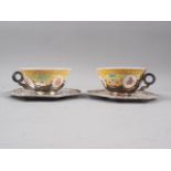A pair of engraved and chased white metal mounted Chinese polychrome enamel decorated cups and