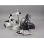 A "Prior" binocular microscope and spot light