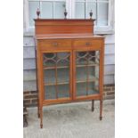 An Edwardian walnut, satinwood banded and line inlaid ledge back display cabinet, fitted two drawers