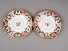 A pair of early 19th century Barr Flight and Barr Worcester Imari decorated armorial plates, 8 1/