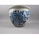 A Chinese blue and white crackle ware jardiniere with bird decoration, 12 3/4" dia