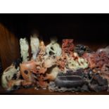 A quantity of mostly Oriental soapstone and hardstone figures and brush washers