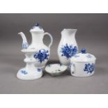 A Royal Copenhagen blue and white floral decorated coffee pot and cover, a companion jug, a