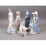A Nao figure of a girl and two geese, 11" high, four other Nao figures and a Lladro figure of a