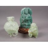 A Chinese carved jade plaque of a figure with carved hardwood stand, 7 3/4" high overall, a carved