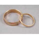 A 9ct gold wedding band, size U, 3.5g, and an 18ct gold wedding band, size J, 1.4g