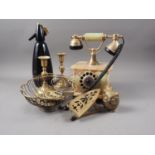 An onyx and brass mounted rotary telephone, a pair of brass candlesticks, a soda siphon, horse