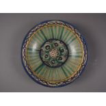 A 19th century Moorish shallow bowl with green, yellow and blue decoration, 14 1/2" dia