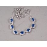 An 18ct white gold diamond and sapphire necklace, 8.7g