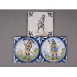 Two Dutch polychrome soldier decorated Delft tiles, 5" square, and one other similar