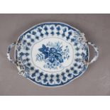 A mid 18th century blue and white Worcester relief decorated two-handled dish, 11" wide (handles