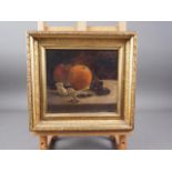 An oil on canvas, still life with orange, apple and dried fruits, 7 3/4" x 8 1/2", in carved gilt