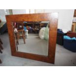 A burr walnut framed wall mirror, bevelled plate 24" x 21 1/2"