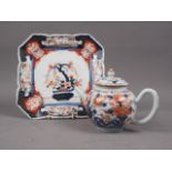 An Imari decorated globular teapot and cover (chips to cover), 5" high, and an Imari dish, 8" square