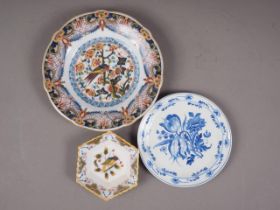 A Makkum Delft polychrome shallow dish with exotic bird decoration, 9 1/2" dia, a smaller similar
