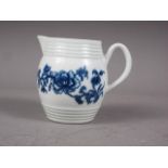 A mid 18th century Worcester blue and white barrel-shaped cream jug with floral decoration, 2 3/4"