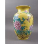 A Chinese porcelain yellow ground vase with bird and flower decoration and verse to reverse, 11"