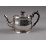 A silver oval-shaped teapot with ebonised knop and handle, 14.6oz troy approx