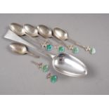 A Georgian silver tablespoon and five silver and enamelled spoons (one damaged), 5.8oz troy approx