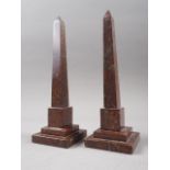 A pair of 19th century serpentine obelisks, on square stepped bases, 9 1/2" high (slight chips to