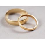 A 22ct gold wedding band, size J, 2.8g, and an 18ct gold wedding band, size W, 3.8g