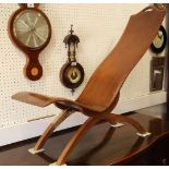 An early 20th century shaped walnut low seat chair, on splay supports