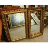 A rectangular gilt framed wall mirror, 25" x 14 1/2", and another similar, 25" x 17"