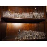 A pair of Waterford wine glasses, a pair of Stuart Crystal whisky tumblers and a quantity of other