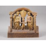 A 18th century South American carved and painted hardwood group, holy family, 8 1/2" wide x 8 1/2"